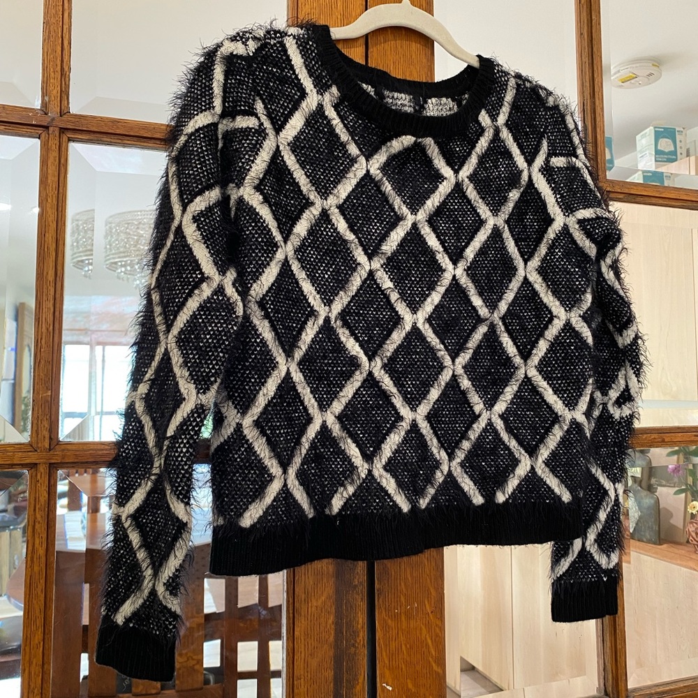 No Tags. Super soft cropped fuzzy sweater. Black & white. Guessing size Small.